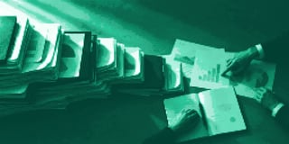 Marketing reports scattered over a desk 