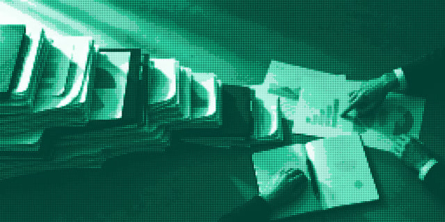 Marketing reports scattered over a desk
