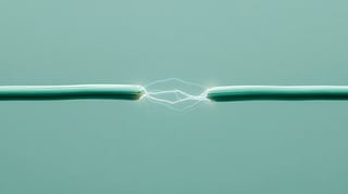 Two cables with electricity arcing between them. 