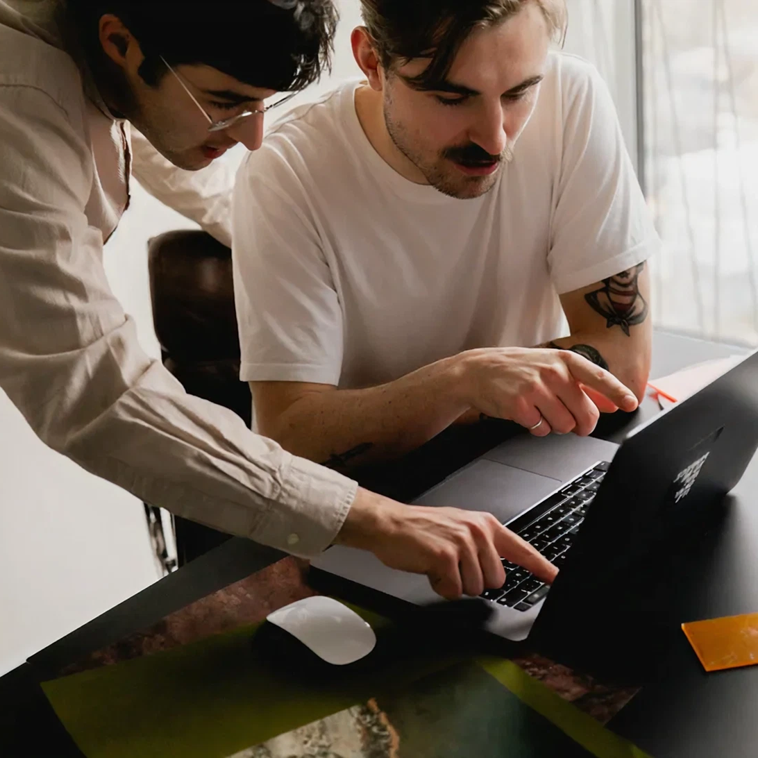 Two guys by computer