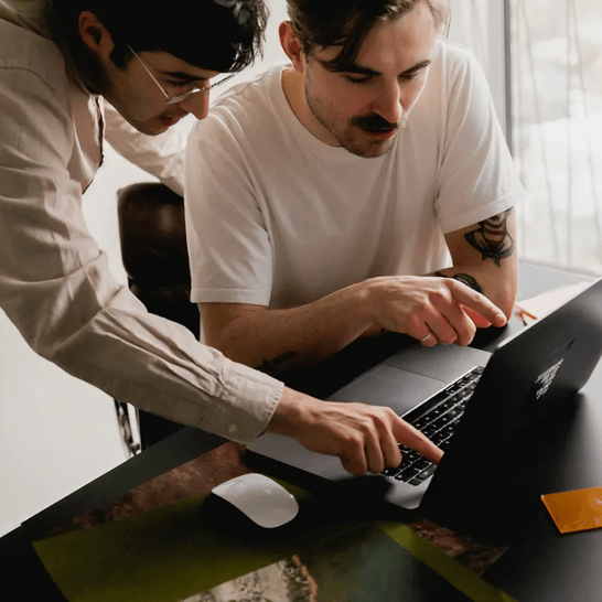 Two guys by computer