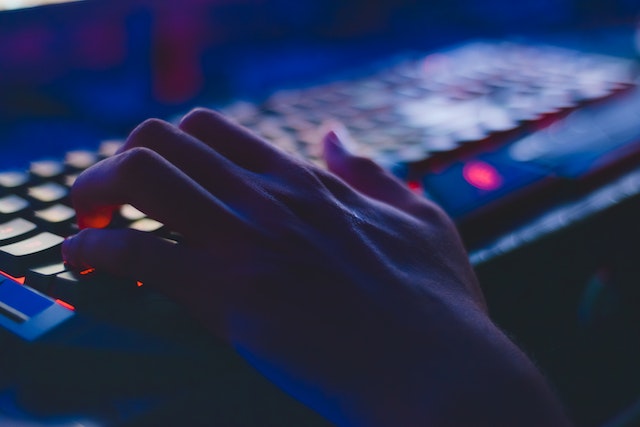 hand on keyboard to represent cloud computing