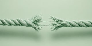 Thick rope pulled from opposite directions with fibers beginning to snap at the center | photorealistic 