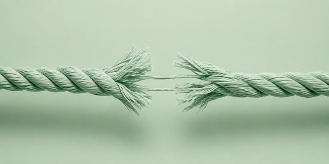 Thick rope pulled from opposite directions with fibers beginning to snap at the center | photorealistic