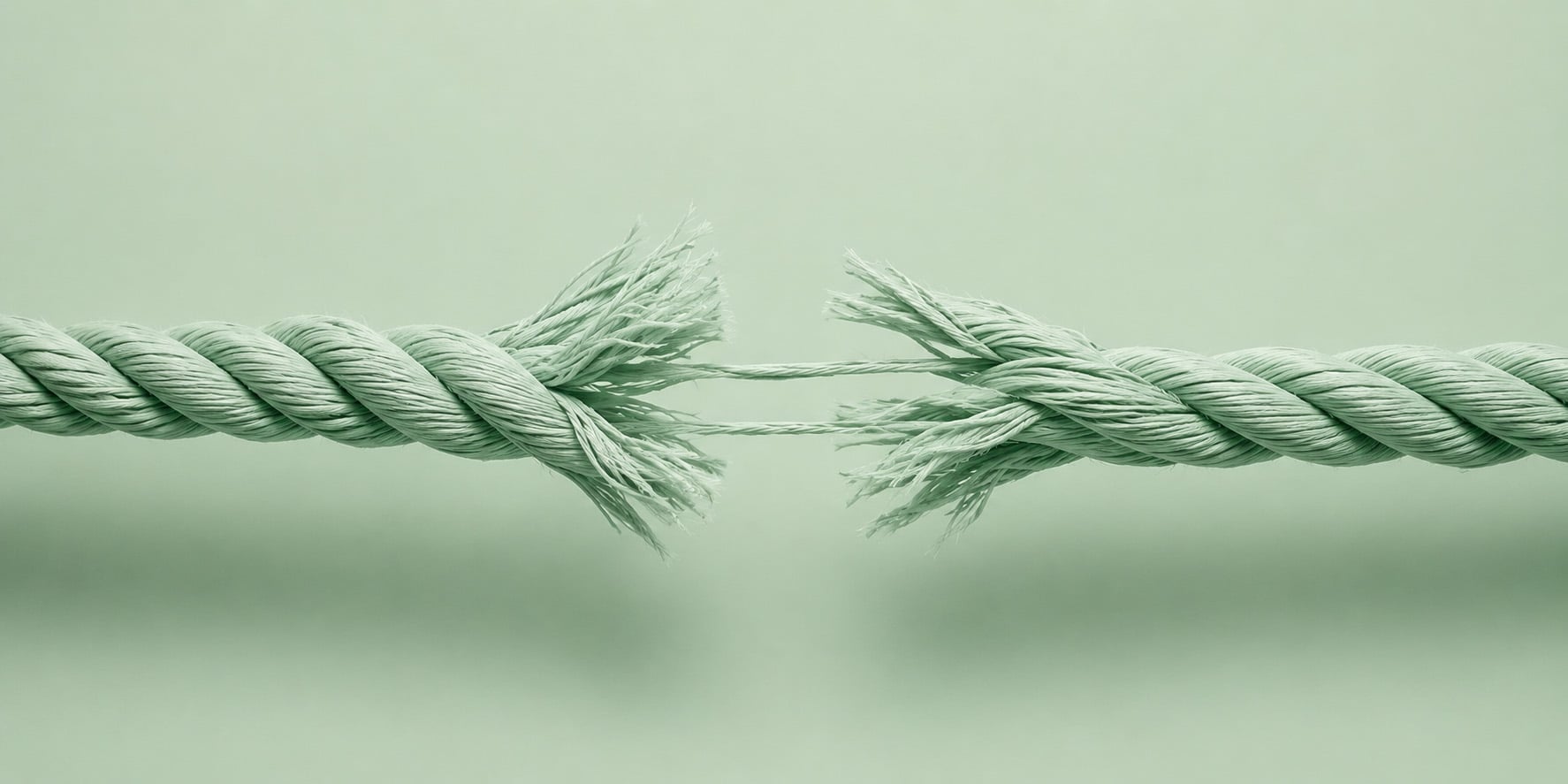 Thick rope pulled from opposite directions with fibers beginning to snap at the center | photorealistic